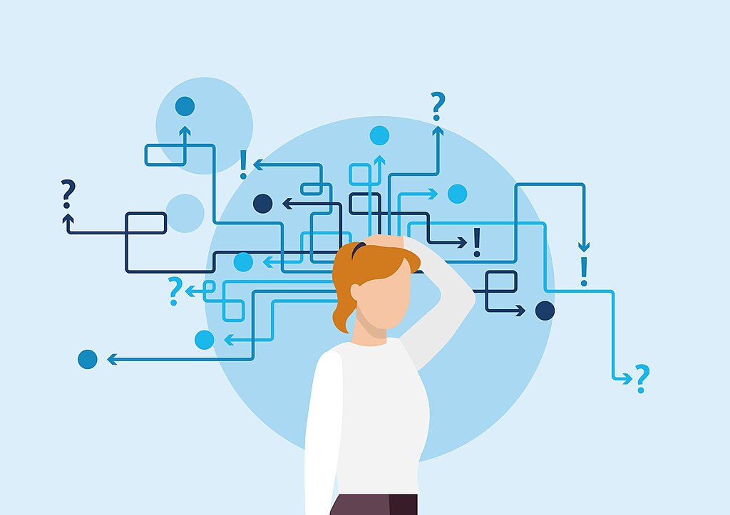 woman standing in front of a labyrinth style puzzle. If we succumb to negative thought patterns such as disqualifying the positive, we can get lost.