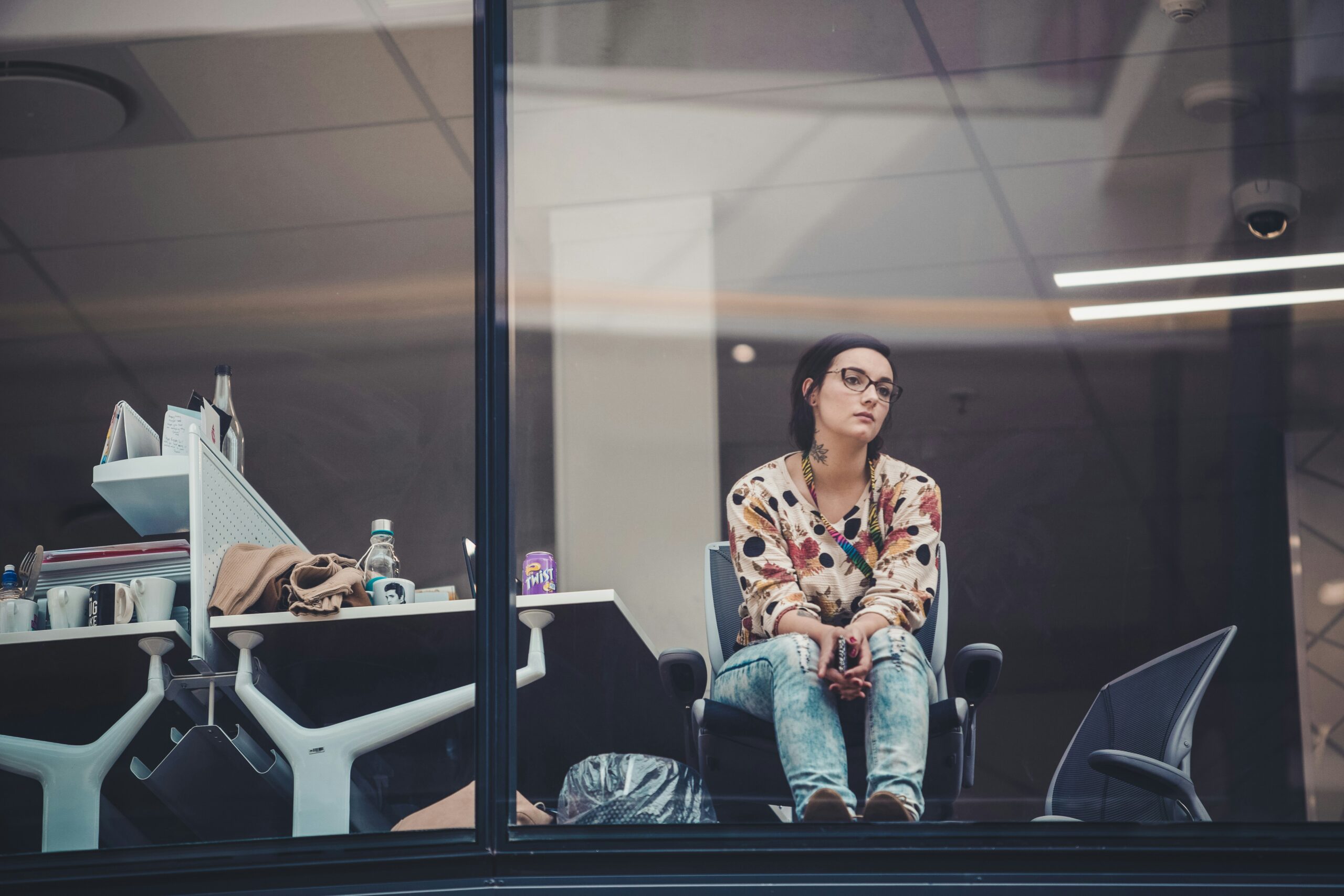 Women sitting in office looking bored and apathetic