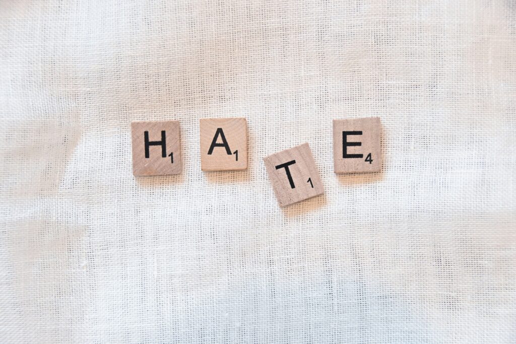 Words "hate" spelled out in block letters: How to overcome hatred